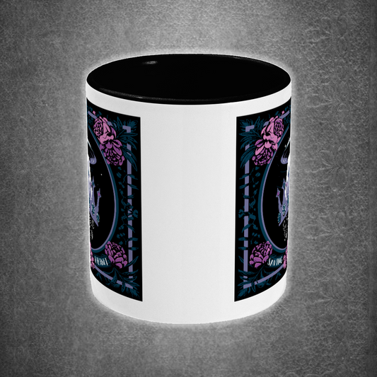 White mug with black interior and handle, featuring a graphic design on a gray background.